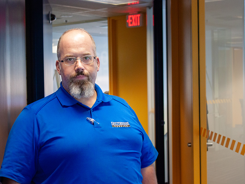 headshot of Rob Hollick Kenyon standing in the concord office